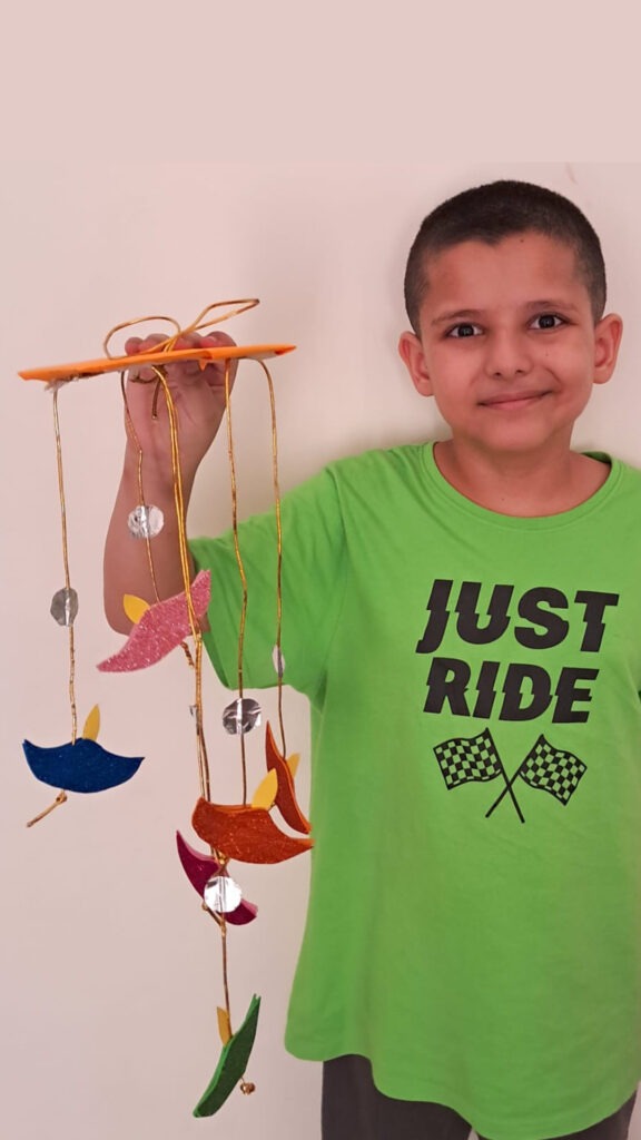 Student of Cyboard school is preparing a wall hanging