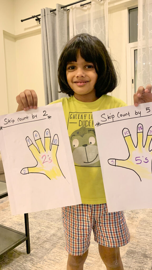 Student of cyboard school is making a drawing of hand for counting